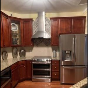 Brushed Nickel over range chimney vent hood..